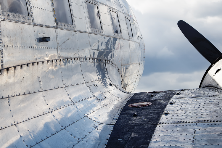 Solid rivets on aircraft fuselage for structural strength